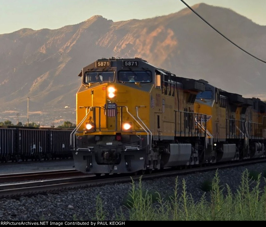 As The Utah Sun Sets on UP 5871 As She Rolls Eastbound towards UP Green River Yard Wyoming with A Manifest Train. 